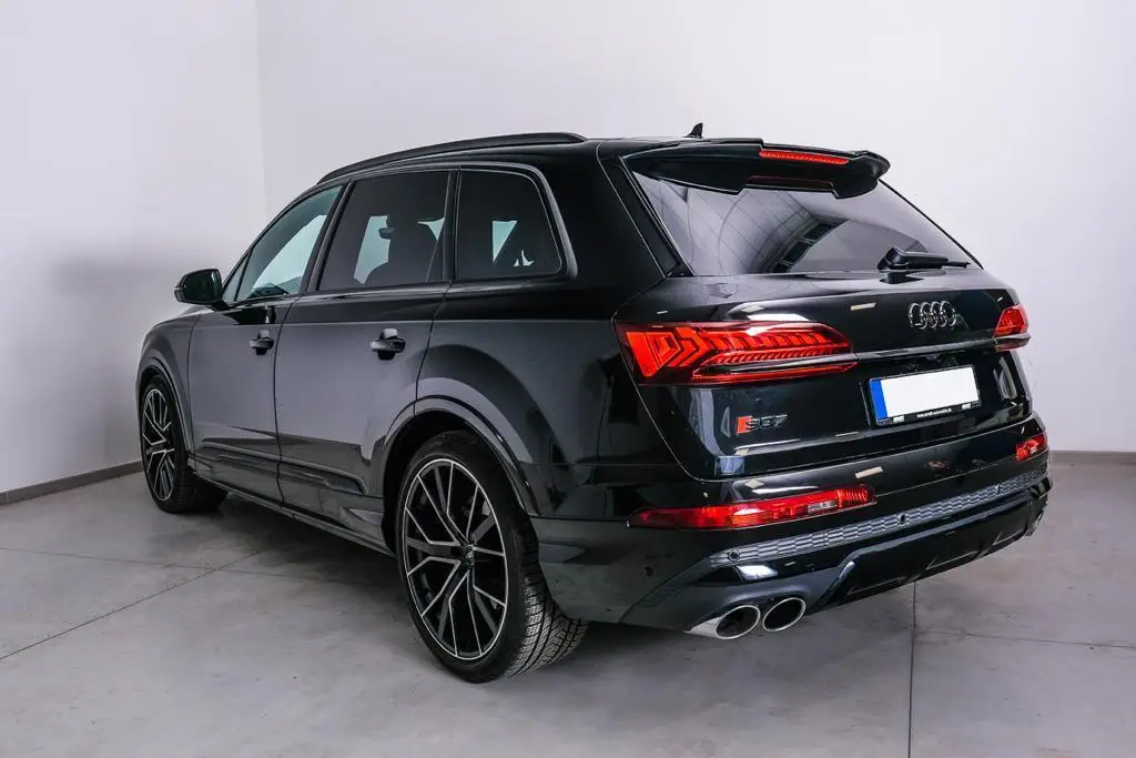 Audi SQ7 2025, rear view — Courchevel Luxury Car Rental, Courchevel. The Audi SQ7 pairs a 507 hp V8 with the composure of a full-size SUV, which is exactly…