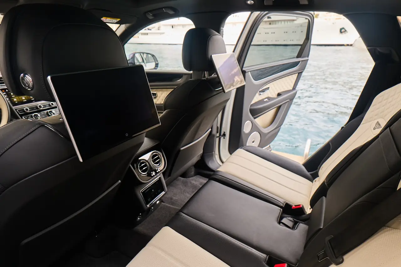 Bentley Bentayga V8-S 2024, interior — Courchevel Luxury Car Rental, Courchevel. The Bentayga V8-S pairs a 550 hp V8 with the cabin space and ride quality that a…