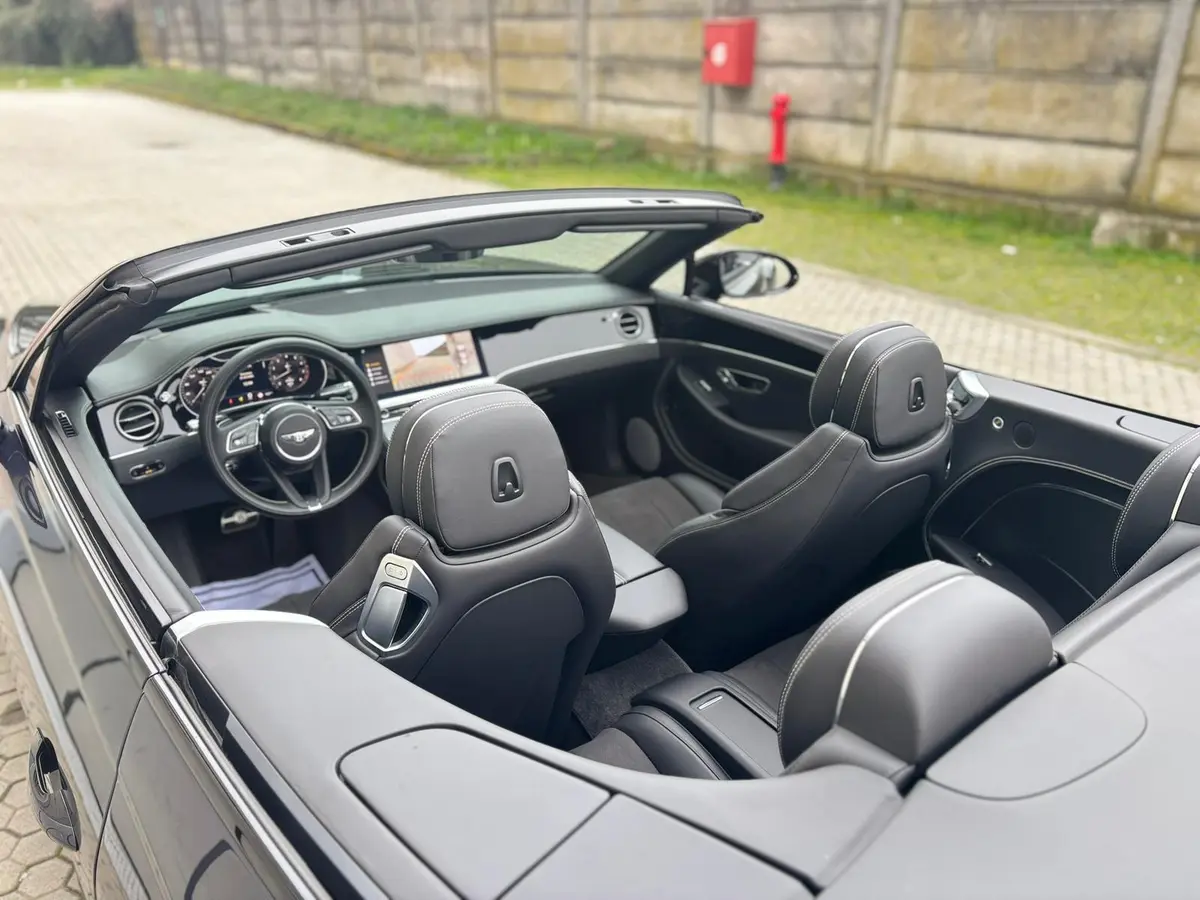 Bentley Continental GTC S V8 2025, side profile — Courchevel Luxury Car Rental, Courchevel. The 2025 Bentley Continental GTC S V8 pairs a 550 hp twin-turbo V8 with a full four-seat…