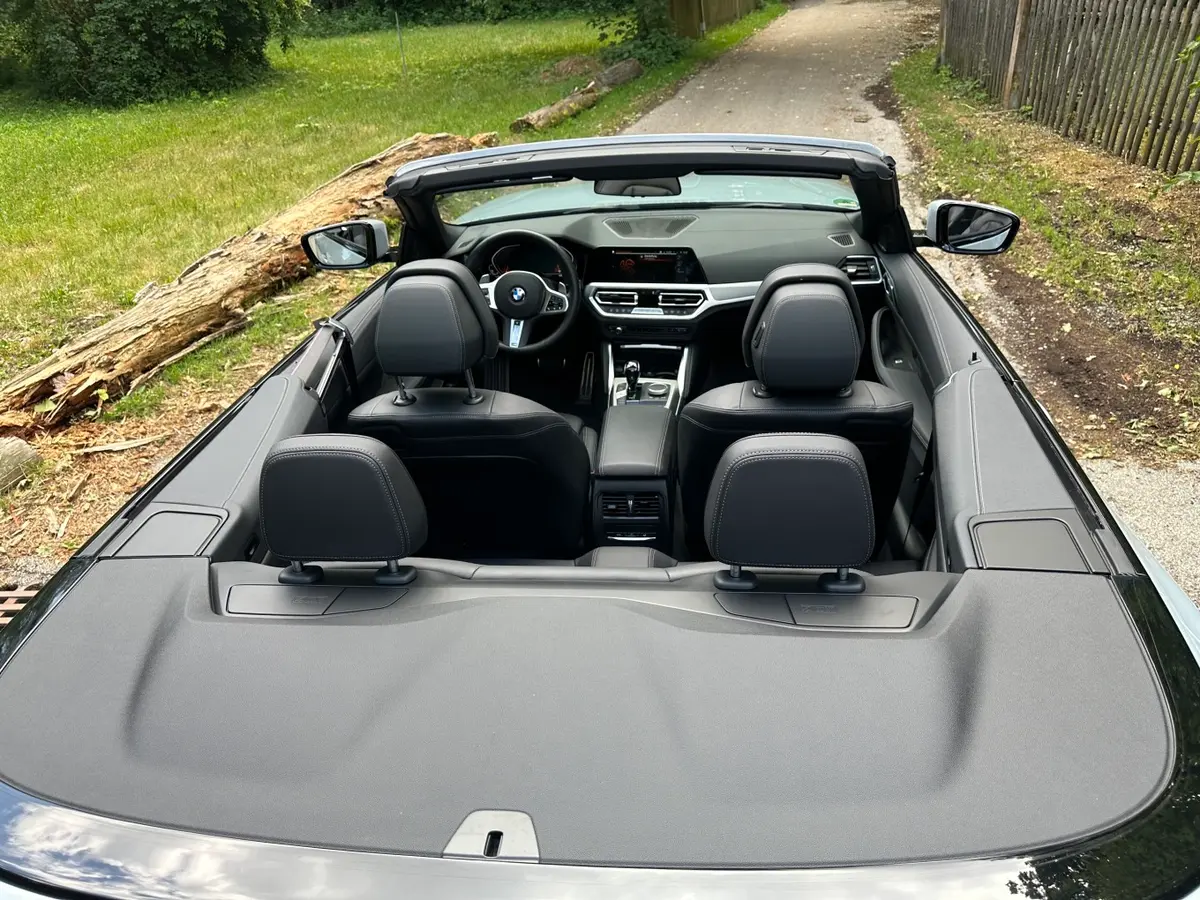 BMW 430i Cabrio 2023, rear view — Courchevel Luxury Car Rental, Courchevel. The BMW 430i Cabrio brings 245 hp and four seats to a fleet otherwise weighted toward…