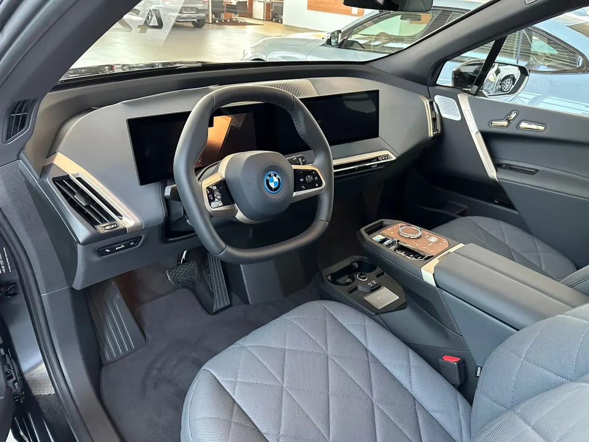 BMW IX M60 2023, exterior — Courchevel Luxury Car Rental, Courchevel. The BMW iX M60 pairs 619 hp with a fully electric drivetrain, giving it a wide, immediate…