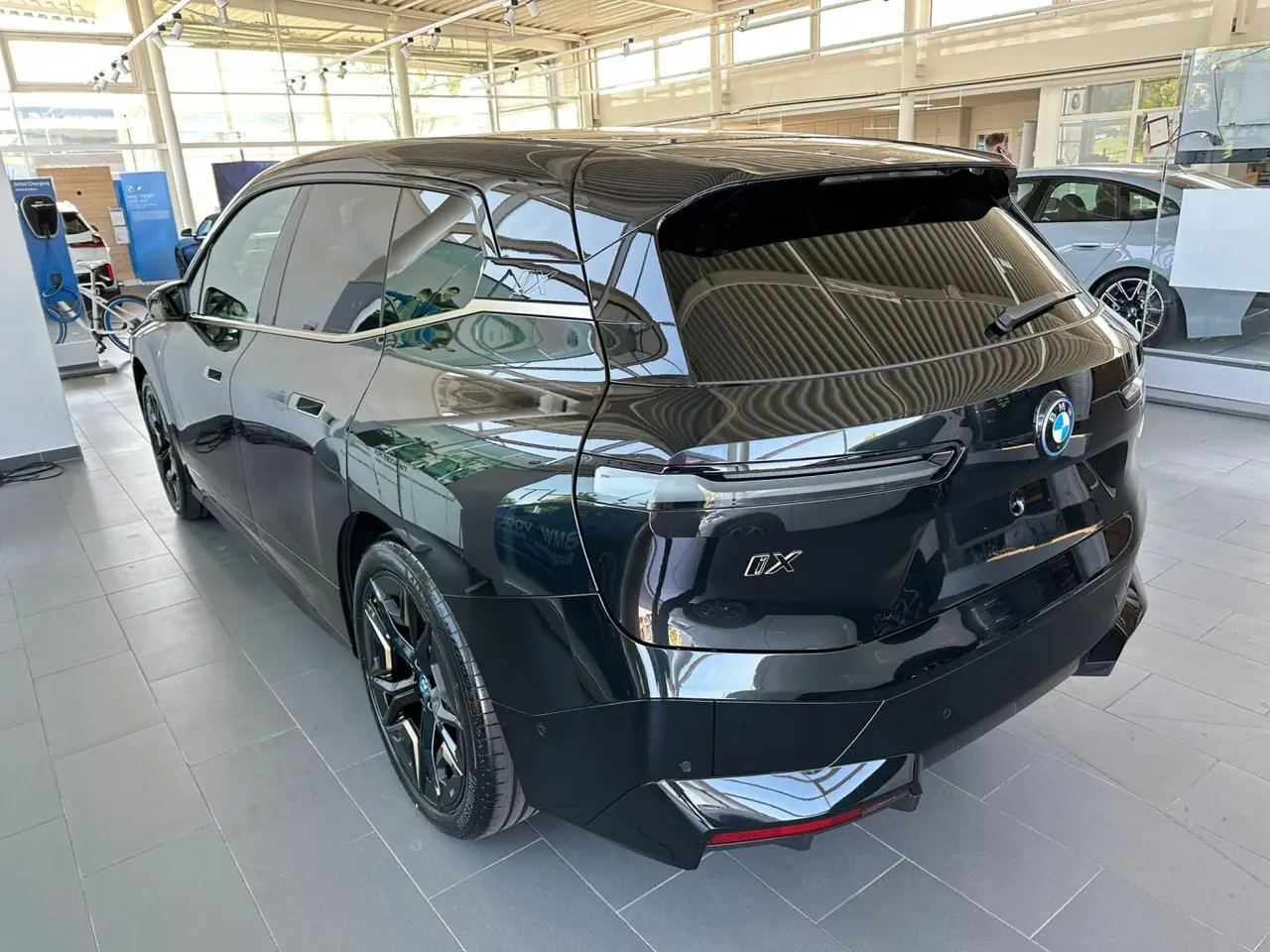 BMW IX M60 2023, rear view — Courchevel Luxury Car Rental, Courchevel. The BMW iX M60 pairs 619 hp with a fully electric drivetrain, giving it a wide, immediate…