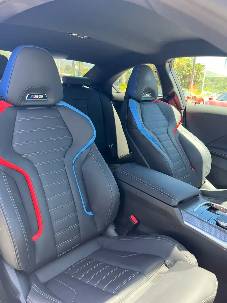 BMW M2 2024, rear view — Courchevel Luxury Car Rental, Courchevel. The 2024 BMW M2 brings 460 hp to a compact, four-seat sport coupe, the kind of car that…
