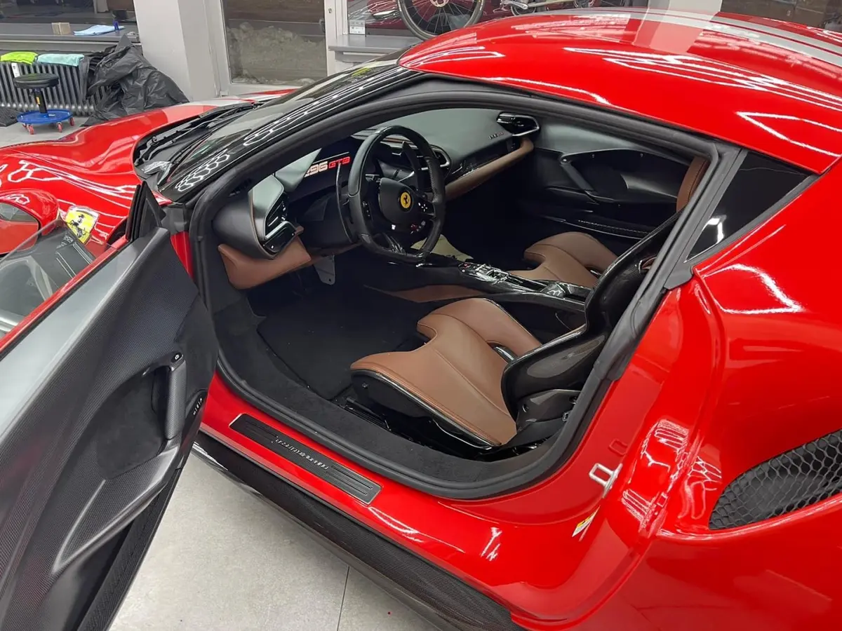 Ferrari 296 GTB 2023, rear view — Courchevel Luxury Car Rental, Courchevel. The Ferrari 296 GTB pairs a mid-engine chassis with 830 hp, and on the open sweeps toward…