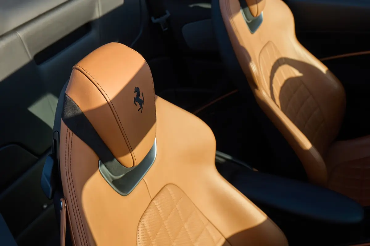 Ferrari Roma Spider 2024, interior — Courchevel Luxury Car Rental, Courchevel. The Ferrari Roma Spider carries its 620 hp with the manners of a grand tourer rather than…