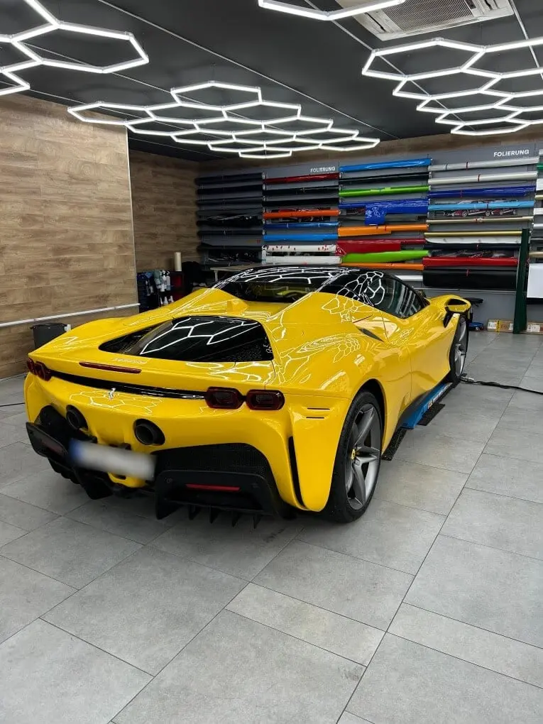 Ferrari SF90 Spider 2024, rear view — Courchevel Luxury Car Rental, Courchevel. The Ferrari SF90 Spider brings 986 hp and a plug-in hybrid drivetrain to a two-seat…
