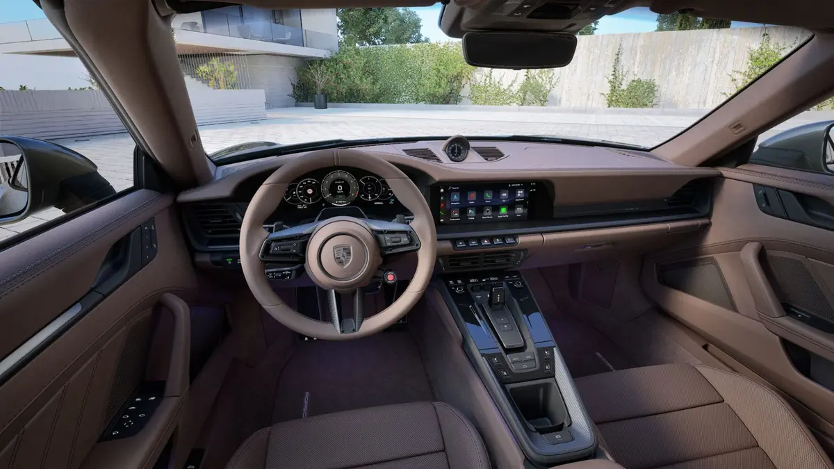 Porsche 911 992 Carrera Turbo S Cabrio 2026, rear view — Courchevel Luxury Car Rental, Courchevel. The 2026 Porsche 911 Carrera Turbo S Cabrio pairs 650 hp with the kind of steering…