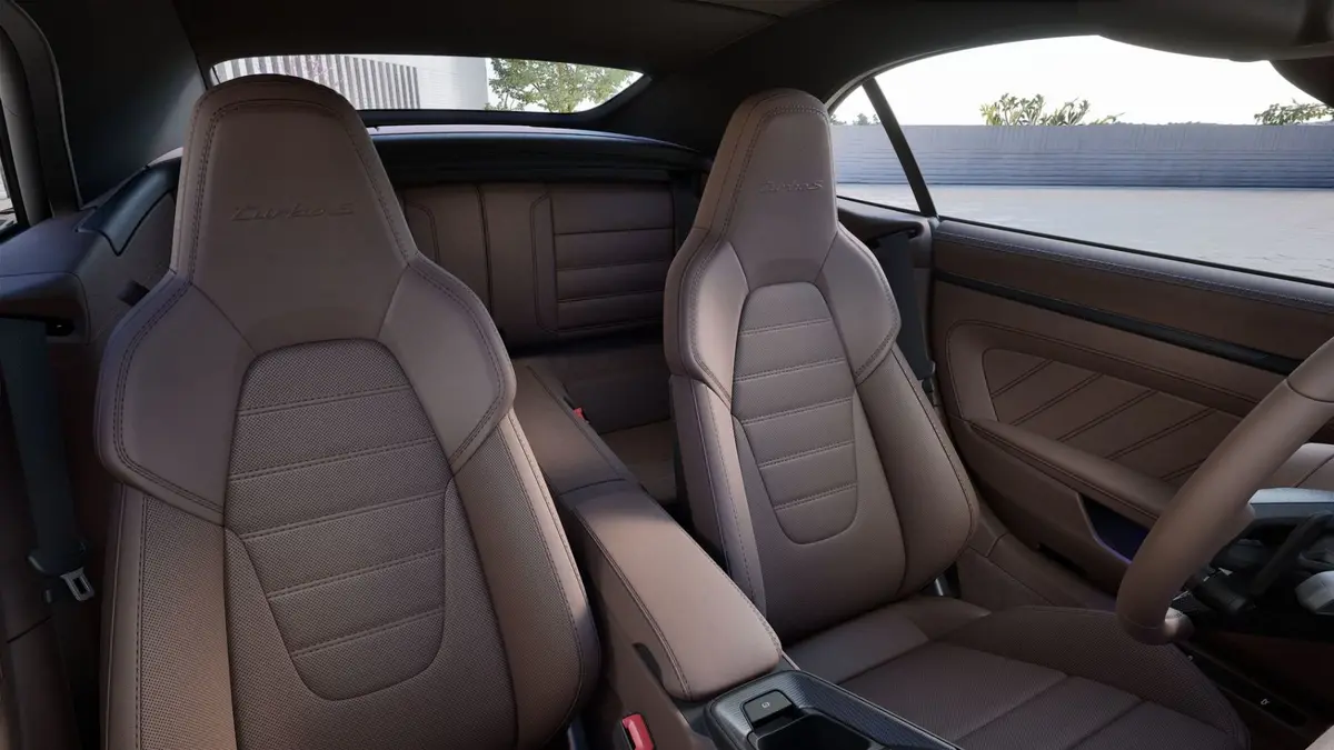 Porsche 911 992 Carrera Turbo S Cabrio 2026, interior — Courchevel Luxury Car Rental, Courchevel. The 2026 Porsche 911 Carrera Turbo S Cabrio pairs 650 hp with the kind of steering…