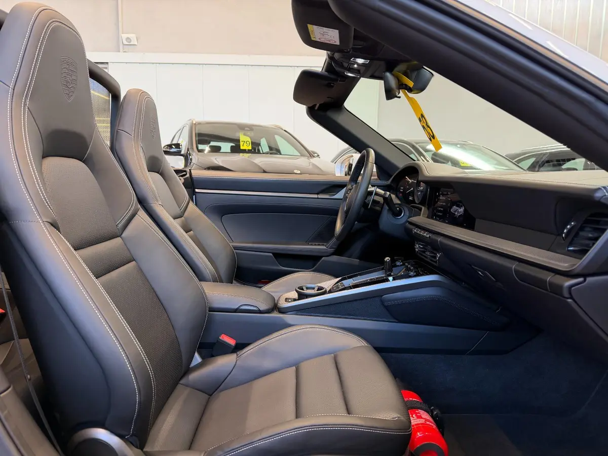 Porsche 911 Carrera S Cabrio (992) 2025, exterior — Courchevel Luxury Car Rental, Courchevel. The 2025 Porsche 911 Carrera S Cabrio (992) pairs 480 hp with the kind of steering…