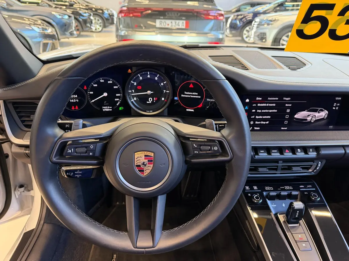 Porsche 911 Carrera S Cabrio (992) 2025, interior — Courchevel Luxury Car Rental, Courchevel. The 2025 Porsche 911 Carrera S Cabrio (992) pairs 480 hp with the kind of steering…