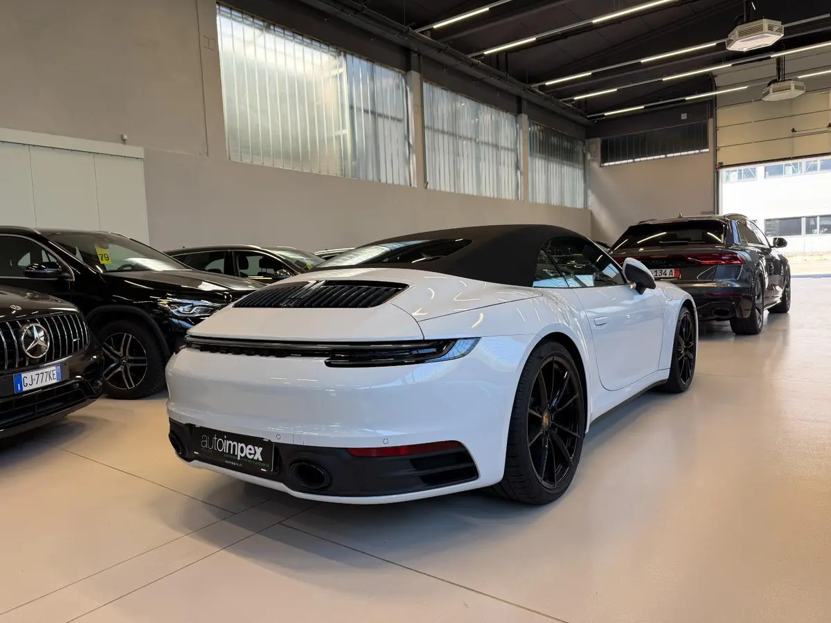 Porsche 911 Carrera S Cabrio (992) 2025, side profile — Courchevel Luxury Car Rental, Courchevel. The 2025 Porsche 911 Carrera S Cabrio (992) pairs 480 hp with the kind of steering…