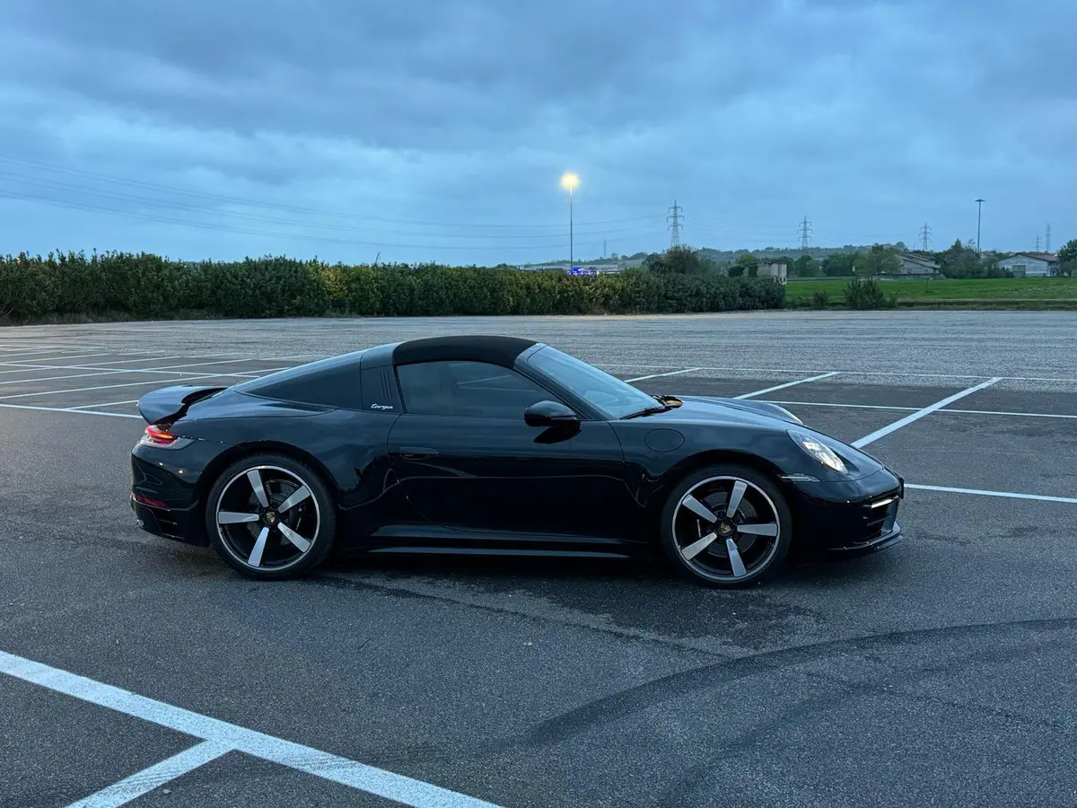 Porsche 911 Targa 2025, front view — Courchevel Luxury Car Rental, Courchevel. The 2025 Porsche 911 Targa pairs 541 hp with the model's signature roll hoop and…