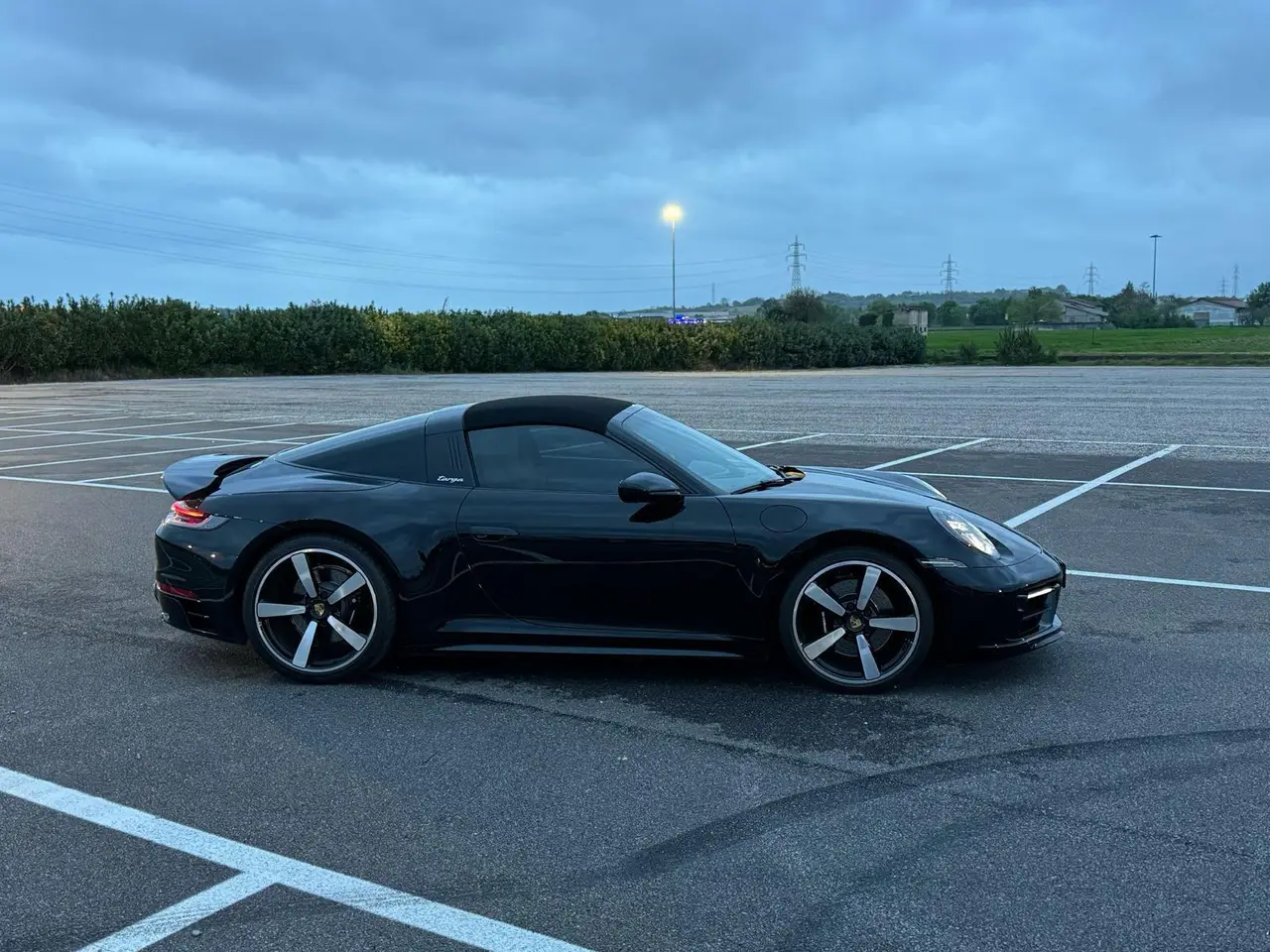Porsche 911 Targa 2025, front view — Courchevel Luxury Car Rental, Courchevel. The 2025 Porsche 911 Targa pairs 541 hp with the model's signature roll hoop and…